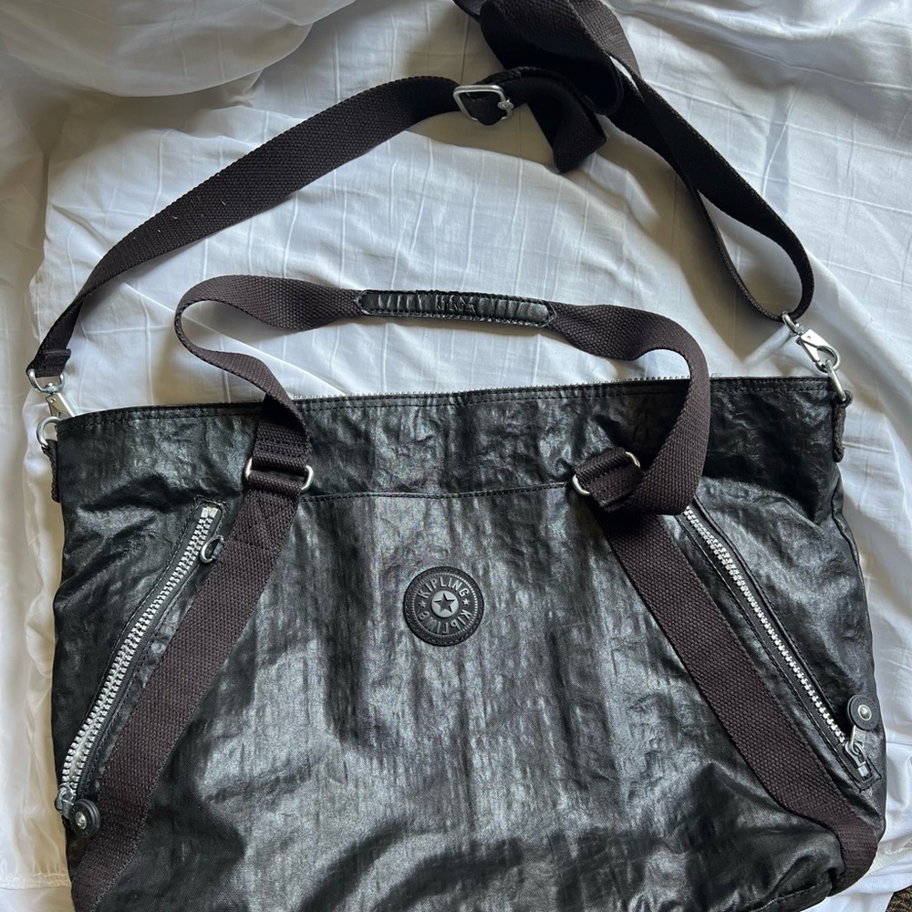Kipling cross body, shoulder/tote bag.  Two zippered pockets on front.